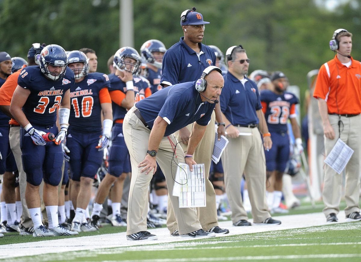 Bucknell head coach Joe Susan working the sideline with his call sheet in hand